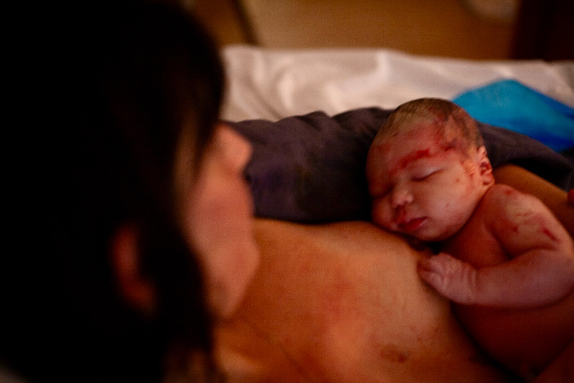 Marion holding her newborn daughter moments after birth